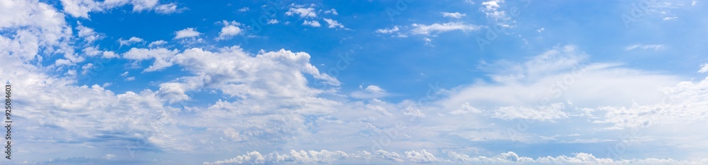 Panoramic background with blue sky with white fluffy clouds Panoramic background with blue sky with white fluffy clouds