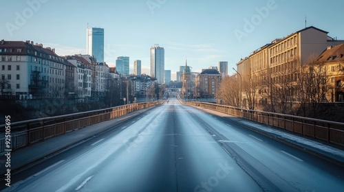 Empty cityscape with a bridge over a river, no vehicles or people, clear skies -