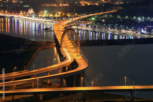 Yeonsu-gu, Incheon, South Korea - August 28, 2014: High angle and night view of car light trajectory on the road of Yeonsu JC and Incheon Bridge on the sea photo