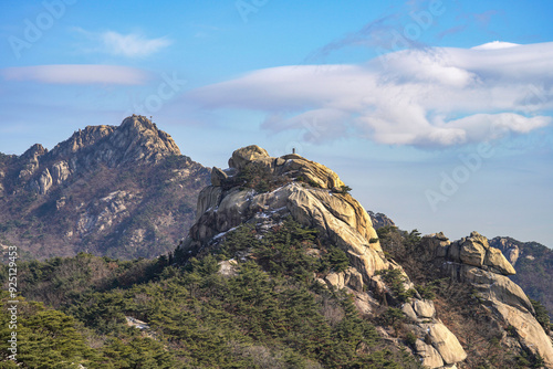 Winter view of Jinheungwang Monument on Bibong Peak against Munsubong at Bukhansan Mountain near Jongno-gu, Seoul, South Korea photo