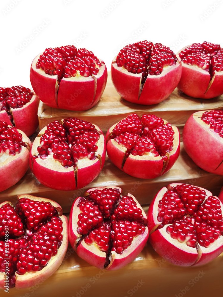 Fresh pomegranate. Picture of a pomegranate cut in half to reveal the seeds inside. Fresh pomegranate. Picture of a pomegranate cut in half to reveal the seeds inside.
