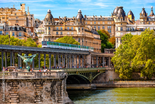 Canvas Print “Pont de Bir-Hakeim“ or “Pont de Passy“  is an arch bridge that crosses the Seine river in Paris (France) with 2 levels for carspedestrians and a metro line