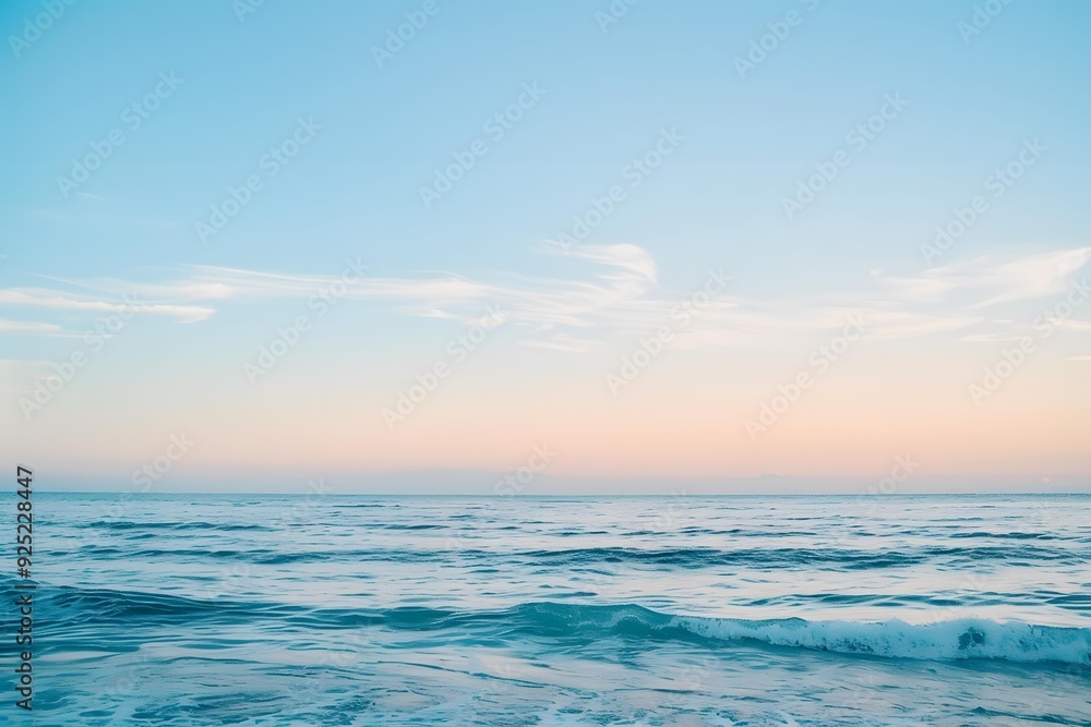 Obraz premium Calm Ocean Water with Pink Sunset Sky