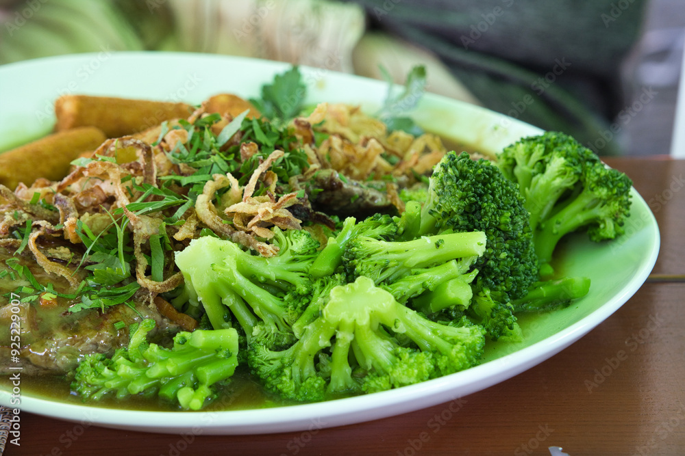 A white plate of freshly cooked, steamed broccoli, vibrant green and ready to eat, offering a healthy, nutritious meal perfect for clean eating and wellness.
A white plate of freshly cooked, steamed broccoli, vibrant green and ready to eat, offering a healthy, nutritious meal perfect for clean eating and wellness.