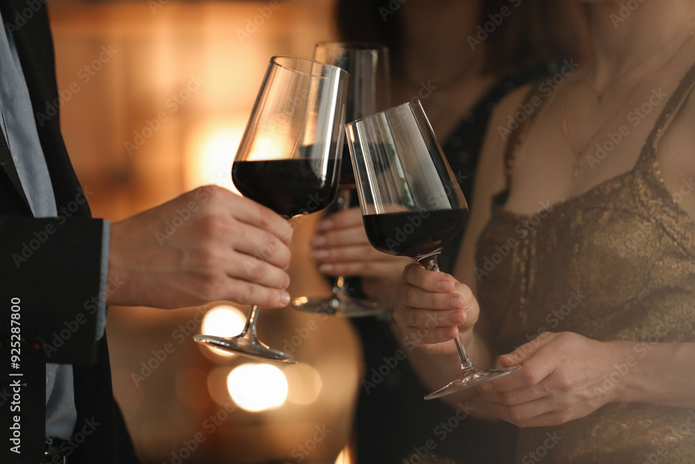 Women and man clinking glasses of tasty wine at party, closeup Women and man clinking glasses of tasty wine at party, closeup