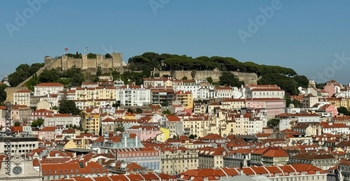 A panoramic view of Lisbon's old town with St George Castle perched on top of the mountain in Lisbon, Portugal