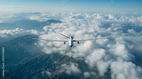 A white military aircraft flies over a forest