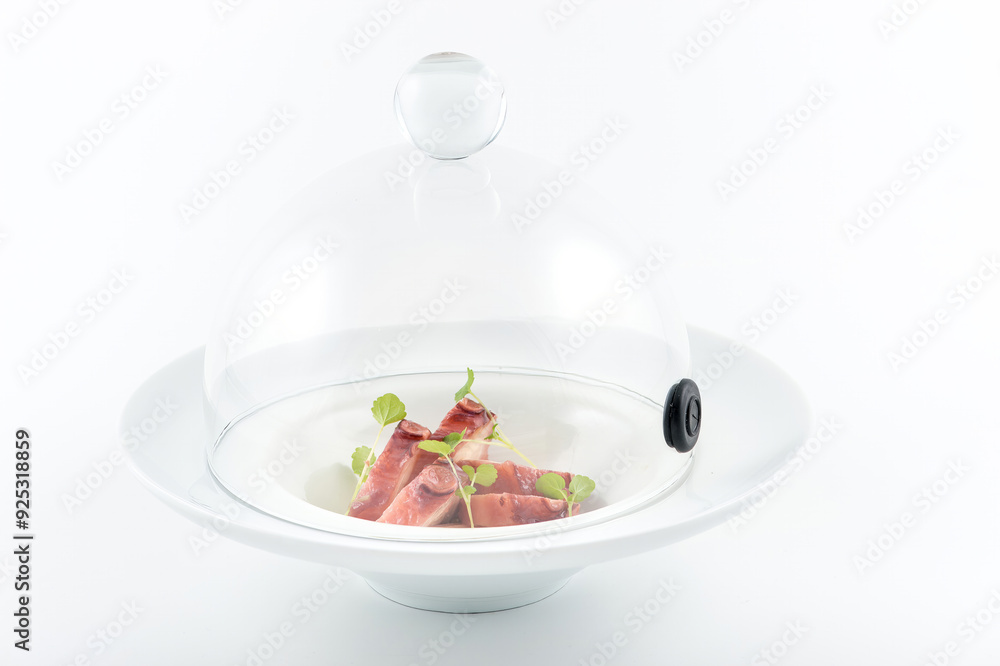 Elegant presentation of prosciutto on a modern serving dome