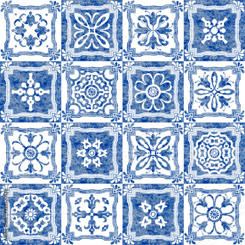 Watercolor seamless pattern of blue tiles with geometrical and floral ornaments in azulejo ceramic style