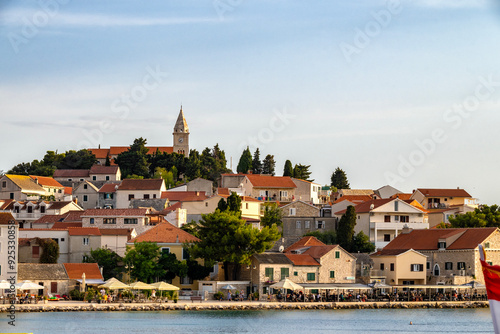 Fototapeta Naklejka Na Ścianę i Meble -  Beautiful, tourist town of Primosten, Croatia with St. George Church on the top of the hill, above small houses