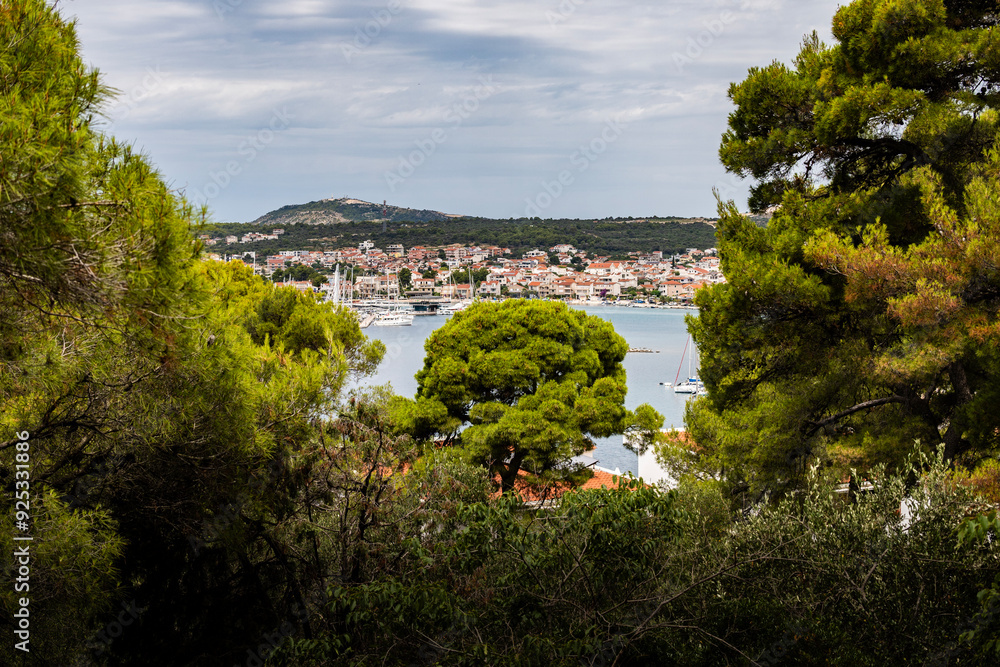 View from the pine tree forest on small, dalmatian houses of Rogoznica, Croatia, popular nautical destination View from the pine tree forest on small, dalmatian houses of Rogoznica, Croatia, popular nautical destination