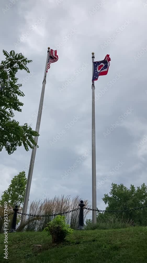 American and Ohio state flag flying in the wind American and Ohio state flag flying in the wind