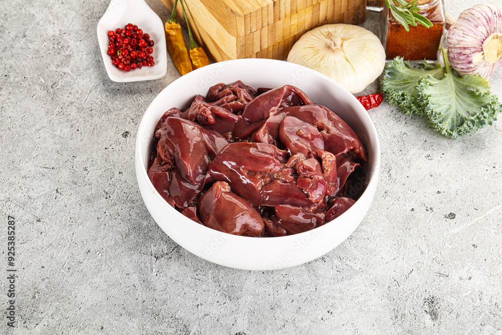 Raw uncooked chicken liver in the bowl Raw uncooked chicken liver in the bowl