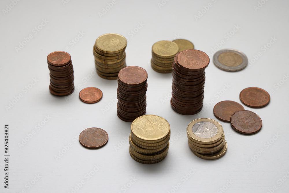 Euro coins of different amounts stacked Euro coins of different amounts stacked
