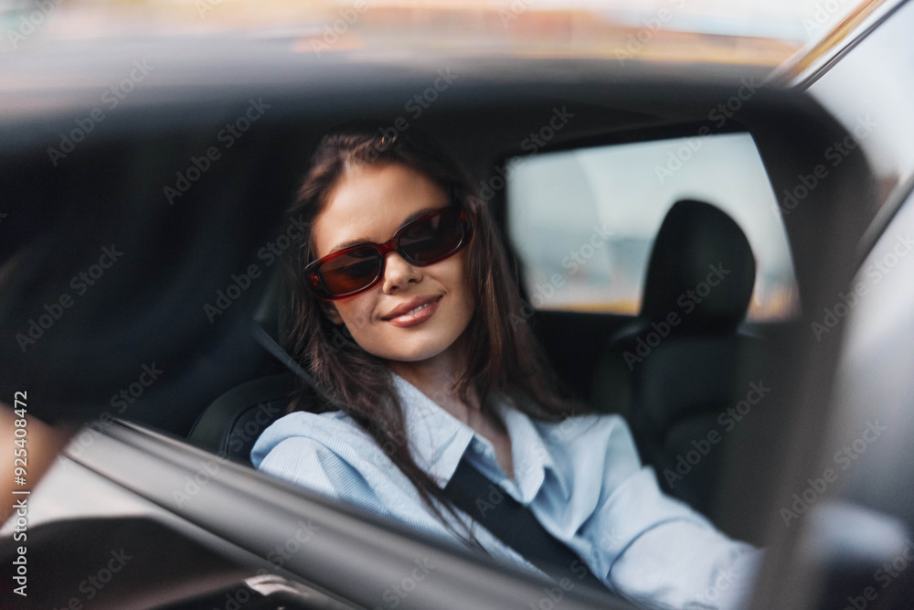 Woman, sunglasses, car, sun, wind a woman wearing sunglasses sits in a car's rearview mirror with the sun illuminating her face and her hair blowing in the wind Woman, sunglasses, car, sun, wind a woman wearing sunglasses sits in a car's rearview mirror with the sun illuminating her face and her hair blowing in the wind
