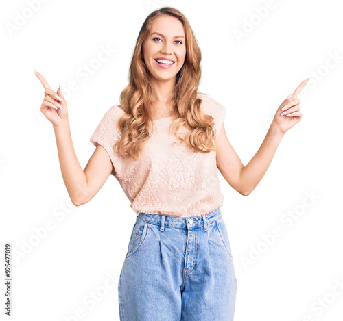 Young beautiful caucasian woman with blond hair wearing casual clothes smiling confident pointing with fingers to different directions. copy space for advertisement