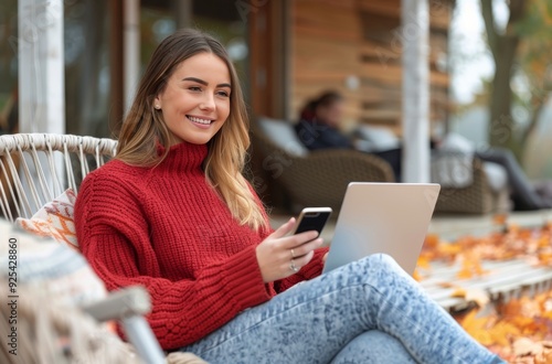 Young Woman Working on Laptop Outdoors During Autumn Sunshine