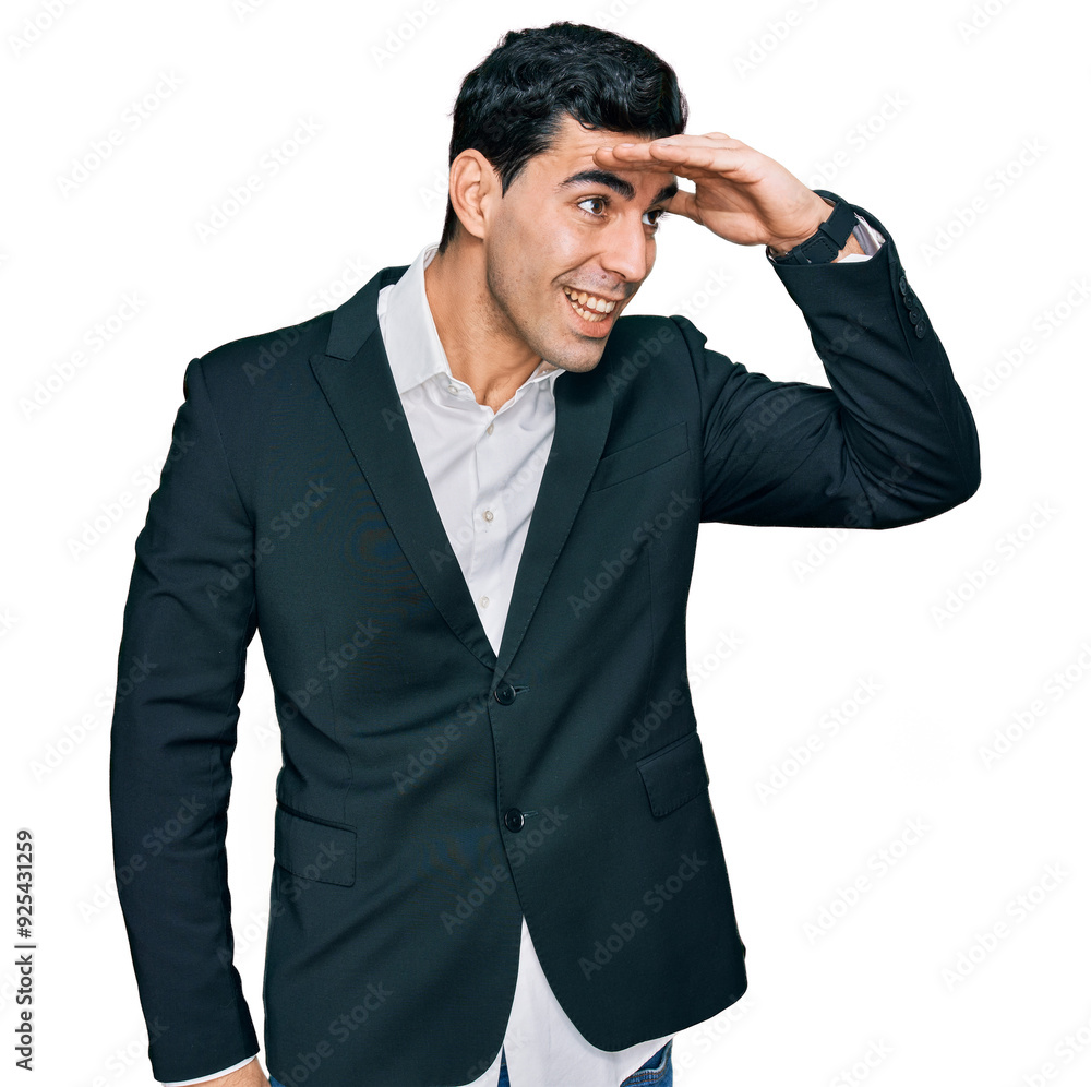 Handsome hispanic man wearing business clothes very happy and smiling looking far away with hand over head. searching concept. Handsome hispanic man wearing business clothes very happy and smiling looking far away with hand over head. searching concept.