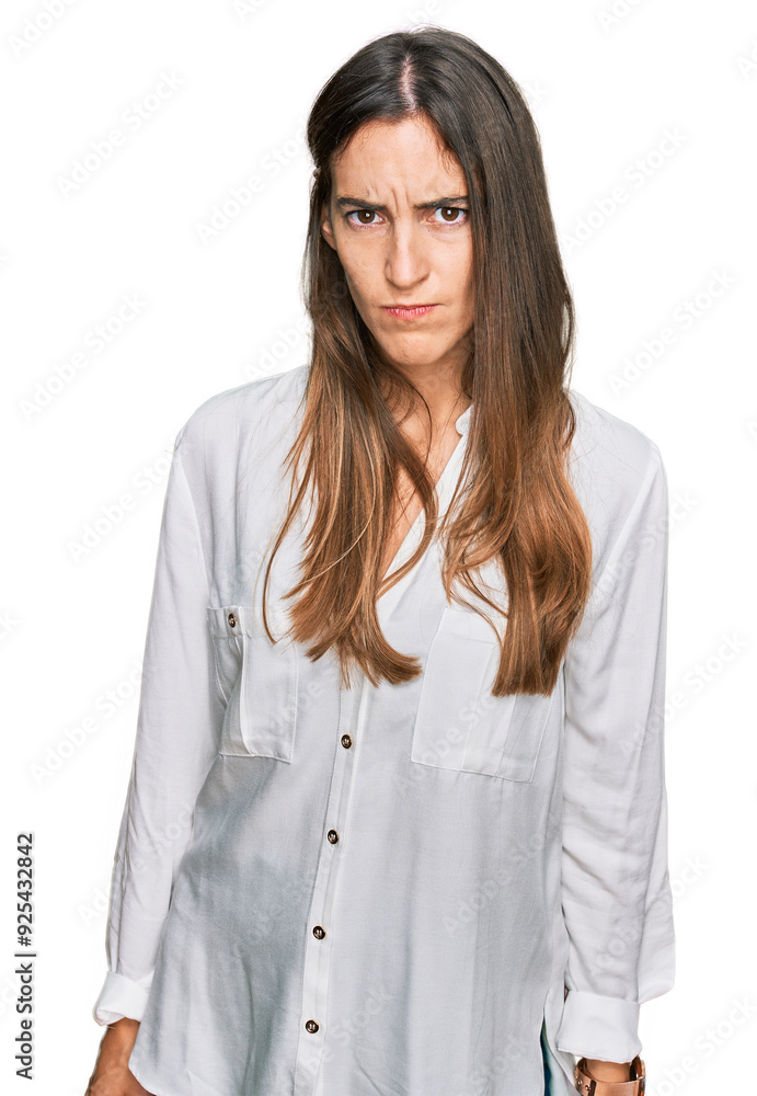 Young beautiful woman wearing casual clothes skeptic and nervous, frowning upset because of problem. negative person. Young beautiful woman wearing casual clothes skeptic and nervous, frowning upset because of problem. negative person.