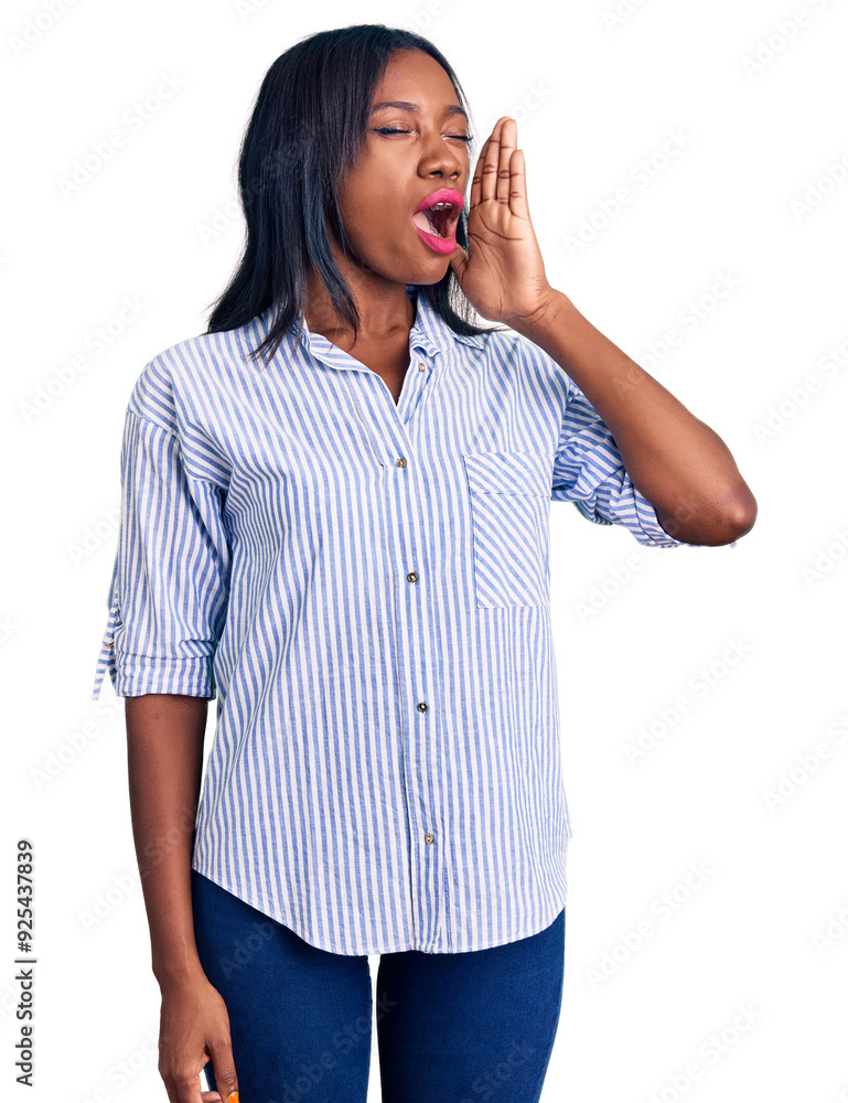 Young african american woman wearing casual clothes shouting and screaming loud to side with hand on mouth. communication concept. Young african american woman wearing casual clothes shouting and screaming loud to side with hand on mouth. communication concept.