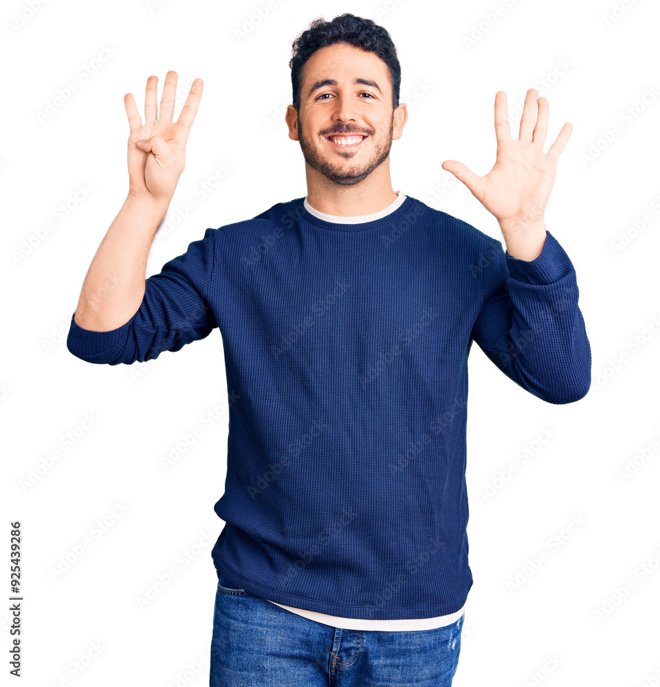 Young hispanic man wearing casual clothes showing and pointing up with fingers number nine while smiling confident and happy. Young hispanic man wearing casual clothes showing and pointing up with fingers number nine while smiling confident and happy.