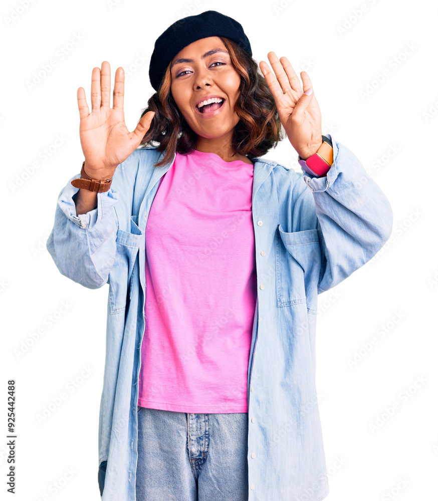 Young beautiful mixed race woman wearing french look with beret showing and pointing up with fingers number nine while smiling confident and happy. Young beautiful mixed race woman wearing french look with beret showing and pointing up with fingers number nine while smiling confident and happy.