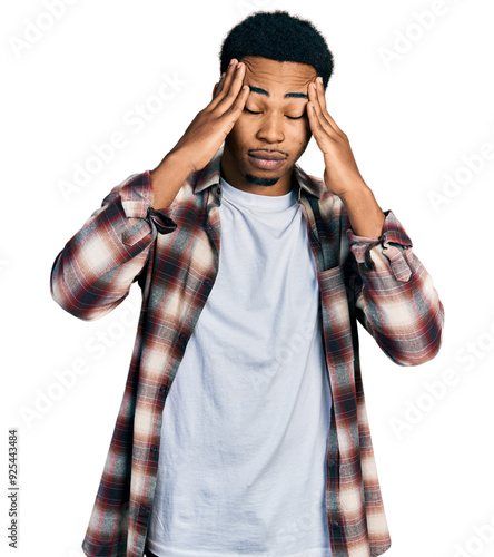 Young african american man wearing casual clothes suffering from headache desperate and stressed because pain and migraine. hands on head. photo