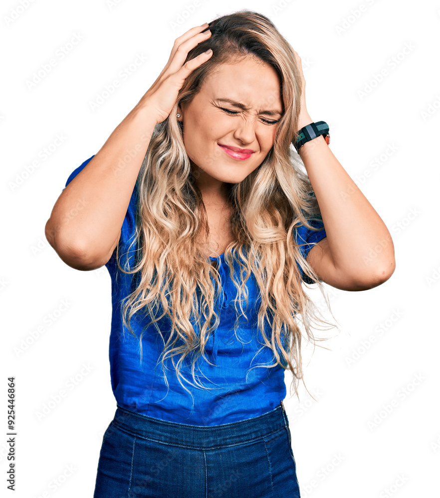 Young blonde woman wearing casual clothes suffering from headache desperate and stressed because pain and migraine. hands on head. Young blonde woman wearing casual clothes suffering from headache desperate and stressed because pain and migraine. hands on head.