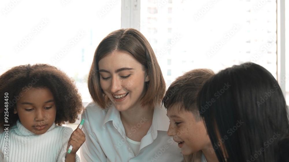 Happy diverse student and smart teacher drawing and coloring by using marker at drawing book. Multicultural smart learner using drawing book while talking to skilled caucasian instructor. Erudition. Happy diverse student and smart teacher drawing and coloring by using marker at drawing book. Multicultural smart learner using drawing book while talking to skilled caucasian instructor. Erudition.