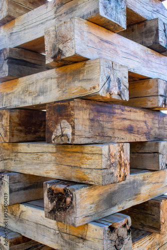 Quadro su tela Wood corner of a old building with dovetail joints.  Tree stumps.