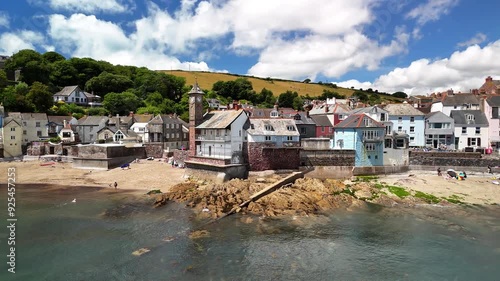 Drone footage of the coastal Kingsand village with green hills in the background in Cornwall, UK photo