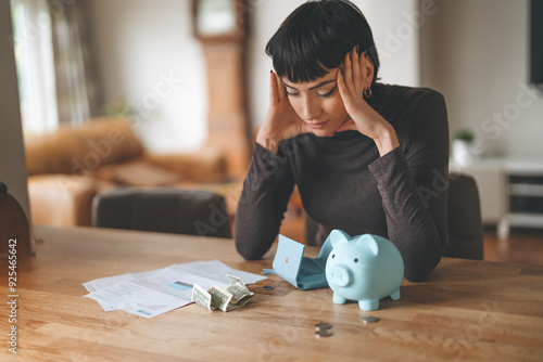 Canvas Print Woman Stressed Over Bills and Finances at Home, Sitting by a Piggy Bank and Cash
