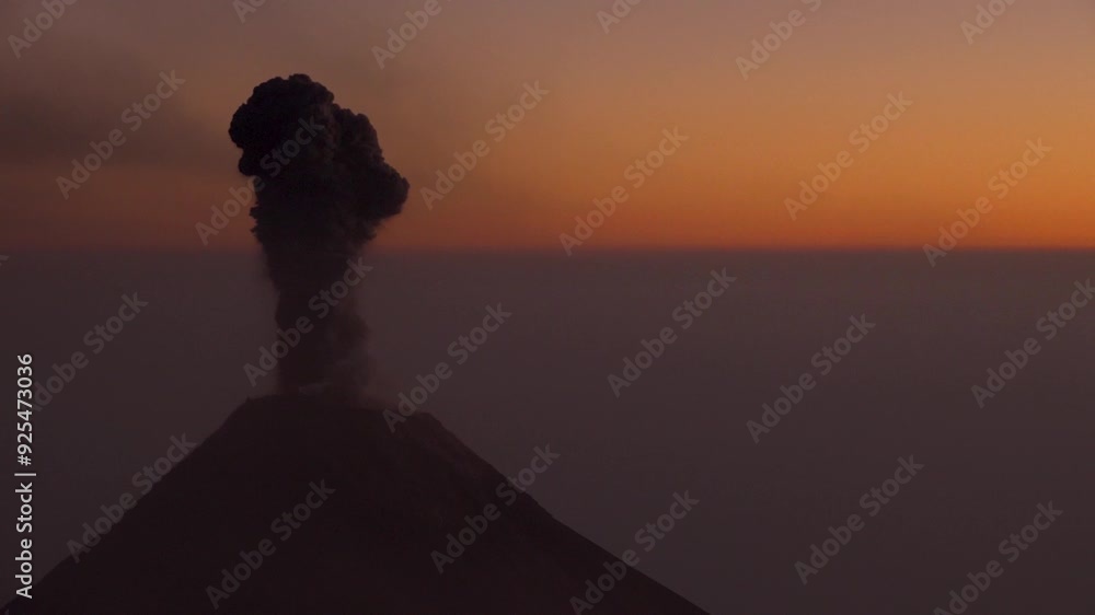Zooming out on Fuego Volcano Erupting at dusk. A view from Acatenango Volcano in Guatemala