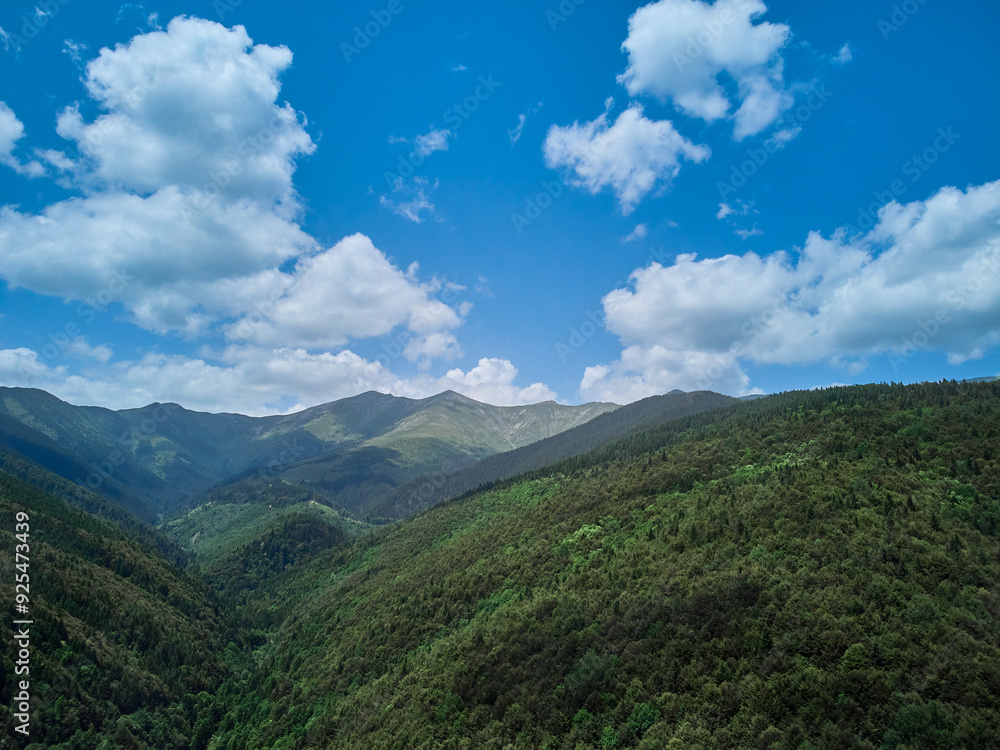 Flying with a drone in the mountains, taking pictures of fir trees, Maria (Mary) river and Marii waterfall in the Retezat Mountains in Uricani, Hunedoara Romania Flying with a drone in the mountains, taking pictures of fir trees, Maria (Mary) river and Marii waterfall in the Retezat Mountains in Uricani, Hunedoara Romania