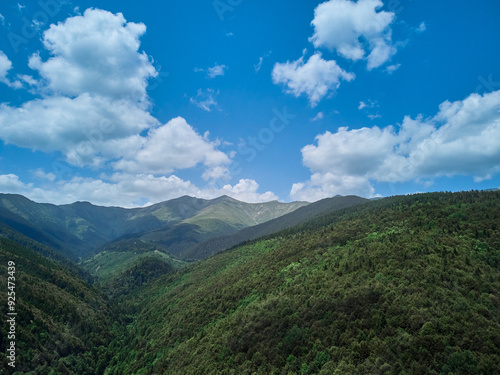 Flying with a drone in the mountains, taking pictures of fir trees, Maria (Mary) river and Marii waterfall in the Retezat Mountains in Uricani, Hunedoara Romania