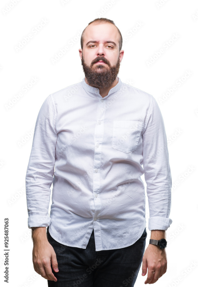 Fototapeta premium Young caucasian hipster man over isolated background with serious expression on face. Simple and natural looking at the camera.