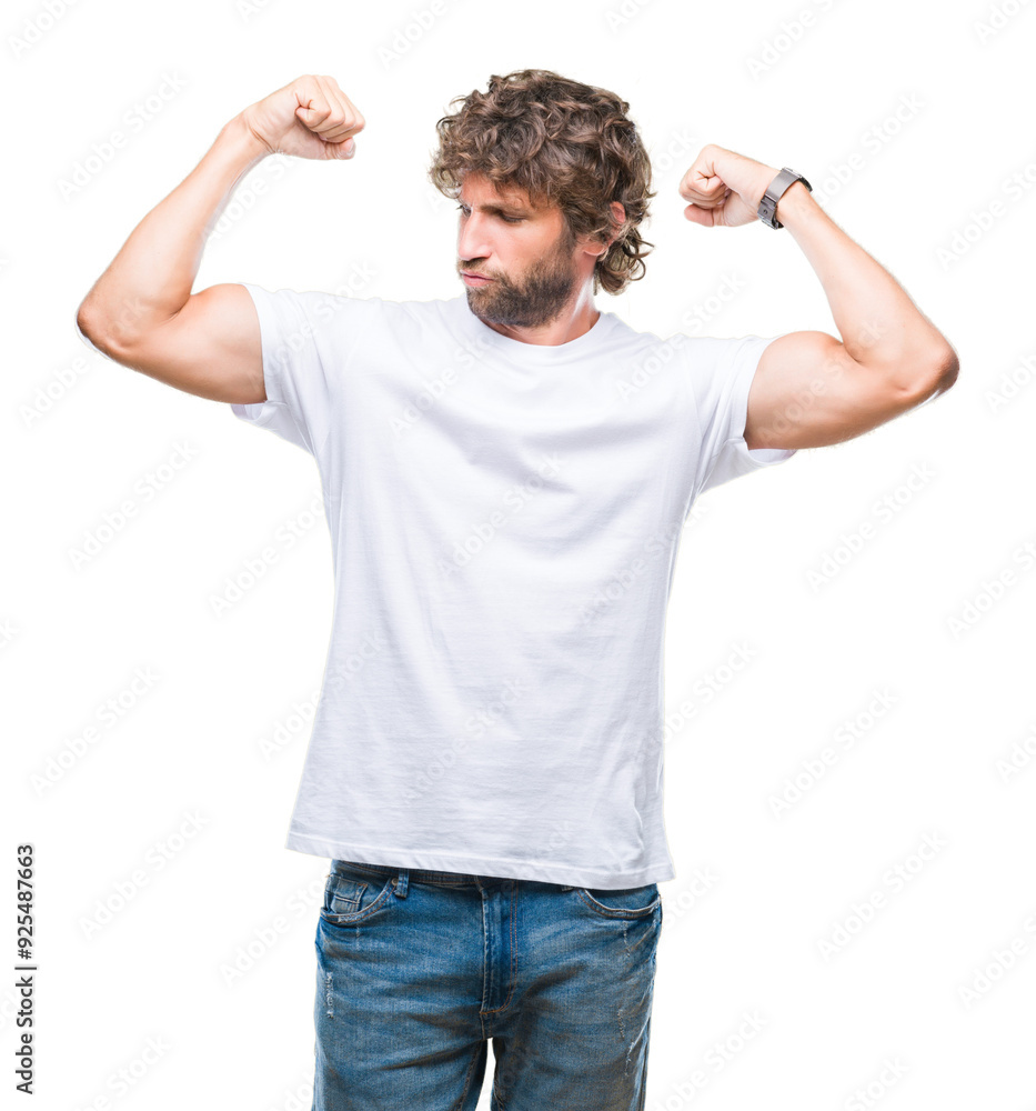 Handsome hispanic model man over isolated background showing arms muscles smiling proud. Fitness concept. Handsome hispanic model man over isolated background showing arms muscles smiling proud. Fitness concept.