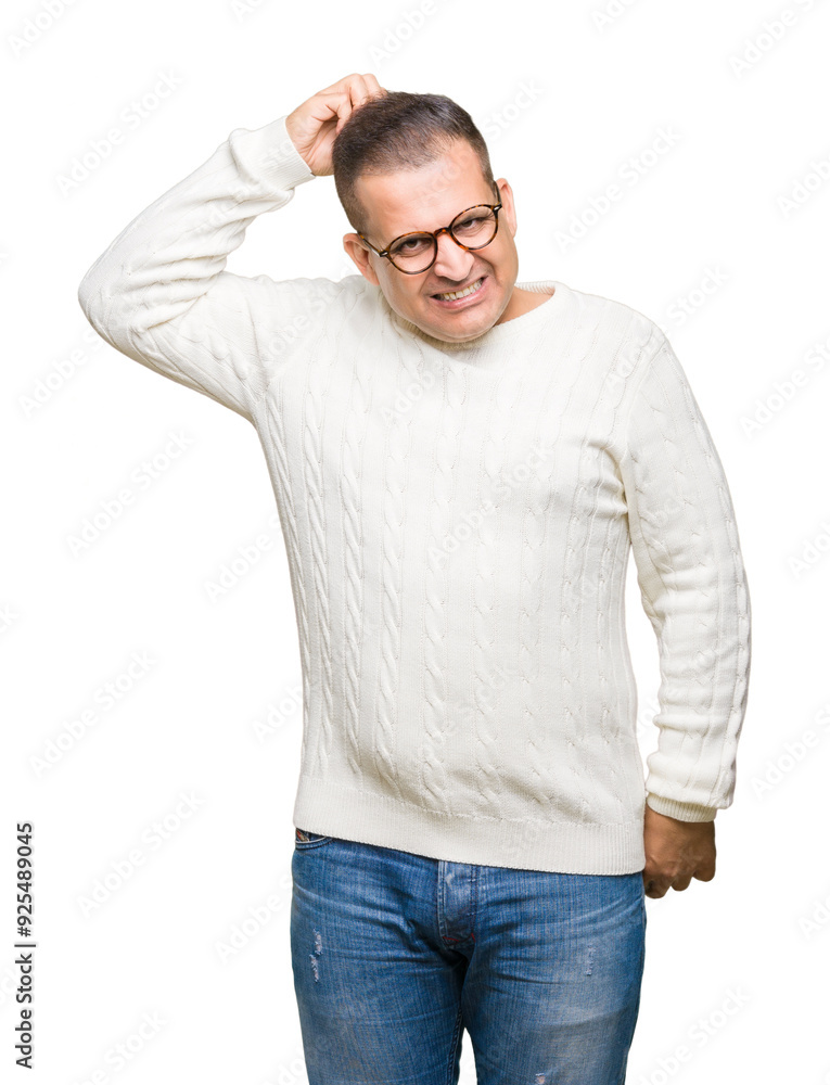Middle age arab man wearing glasses over isolated background confuse and wonder about question. Uncertain with doubt, thinking with hand on head. Pensive concept. Middle age arab man wearing glasses over isolated background confuse and wonder about question. Uncertain with doubt, thinking with hand on head. Pensive concept.