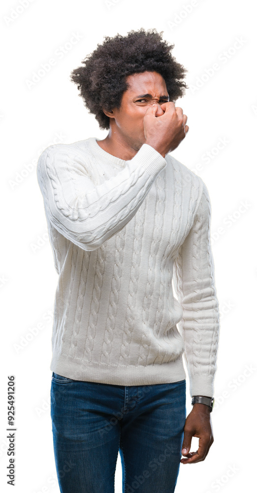 Afro american man over isolated background smelling something stinky and disgusting, intolerable smell, holding breath with fingers on nose. Bad smells concept. Afro american man over isolated background smelling something stinky and disgusting, intolerable smell, holding breath with fingers on nose. Bad smells concept.