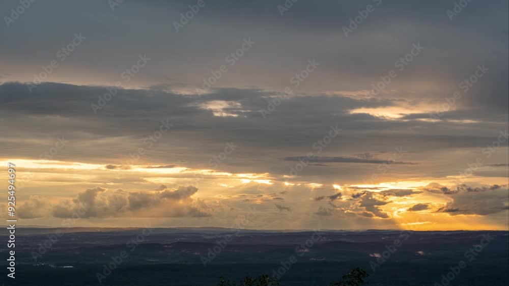 Timelapse of Sun shining through clouds
