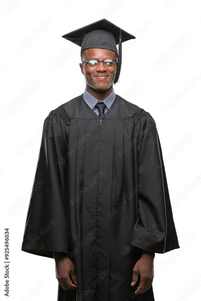 Young graduated african american man over isolated background smiling looking side and staring away thinking. Young graduated african american man over isolated background smiling looking side and staring away thinking.