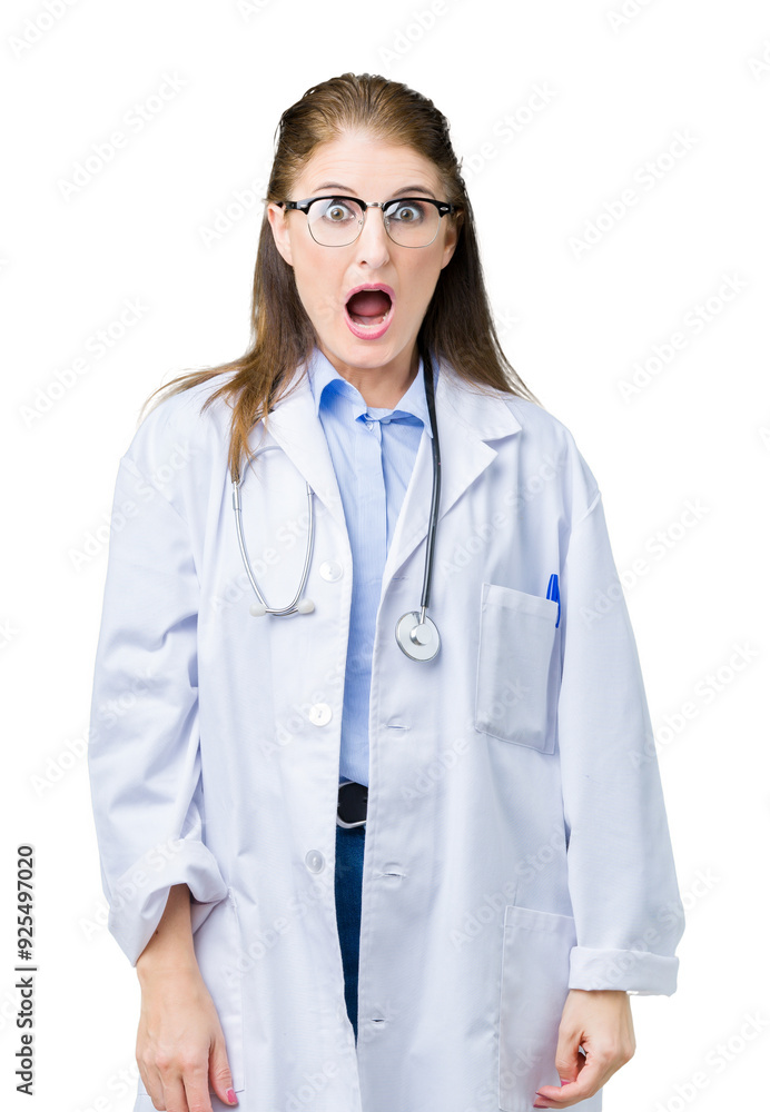 Middle age mature doctor woman wearing medical coat over isolated background In shock face, looking skeptical and sarcastic, surprised with open mouth Middle age mature doctor woman wearing medical coat over isolated background In shock face, looking skeptical and sarcastic, surprised with open mouth