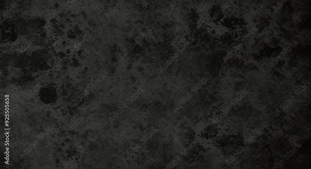 Black background made of real, shiny black paper covered with foil, illuminated by a soft light from above. Black background made of real, shiny black paper covered with foil, illuminated by a soft light from above.