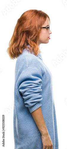 Young beautiful woman over isolated background wearing winter sweater looking to side, relax profile pose with natural face with confident smile.