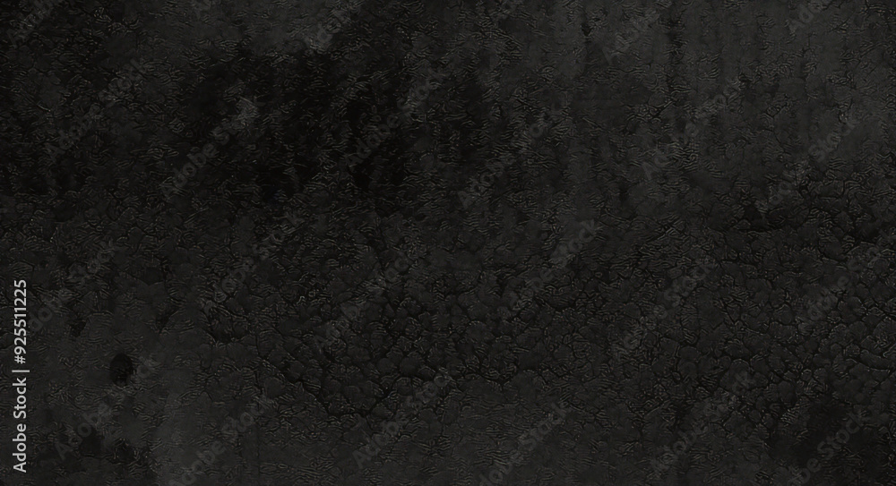 Black background made of real, shiny black paper covered with foil, illuminated by a soft light from above. Black background made of real, shiny black paper covered with foil, illuminated by a soft light from above.
