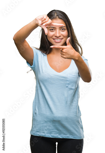 Young beautiful arab woman over isolated background smiling making frame with hands and fingers with happy face. Creativity and photography concept. photo