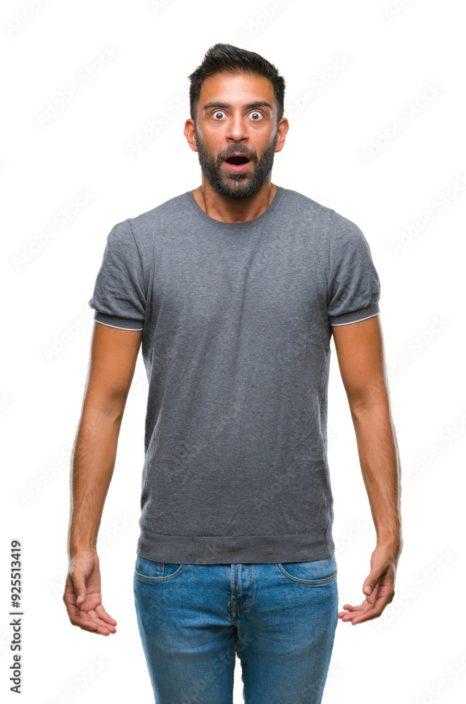 Adult hispanic man over isolated background afraid and shocked with surprise expression, fear and excited face. Adult hispanic man over isolated background afraid and shocked with surprise expression, fear and excited face.