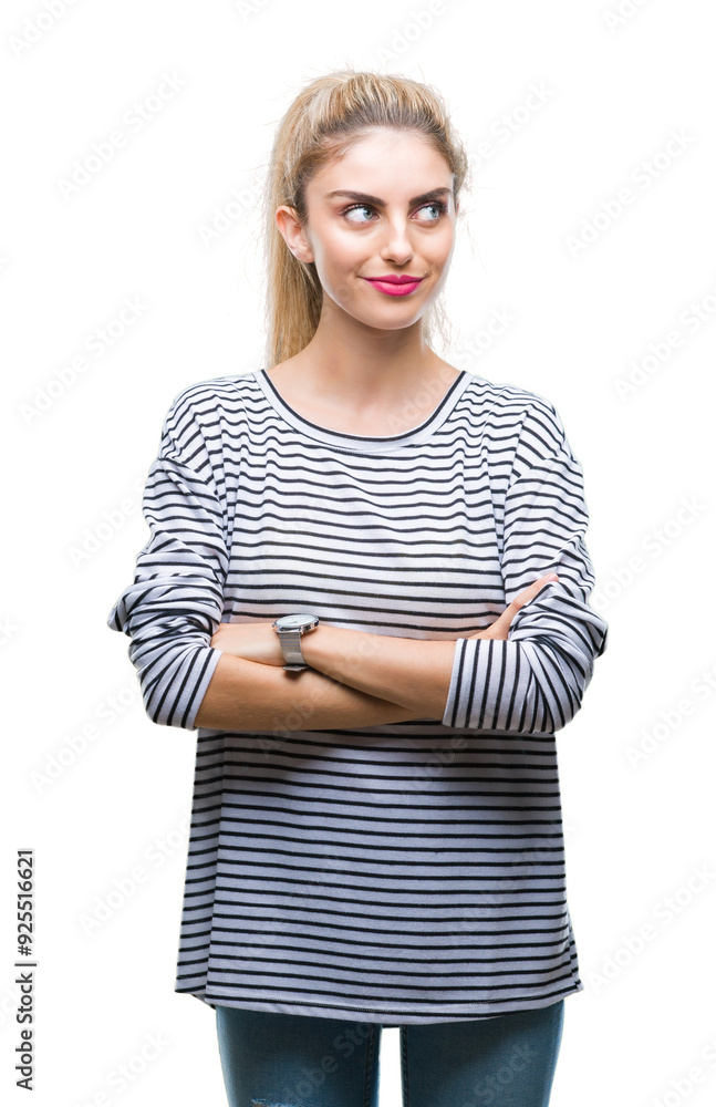 Young beautiful blonde woman wearing stripes sweater over isolated background smiling looking side and staring away thinking. Young beautiful blonde woman wearing stripes sweater over isolated background smiling looking side and staring away thinking.