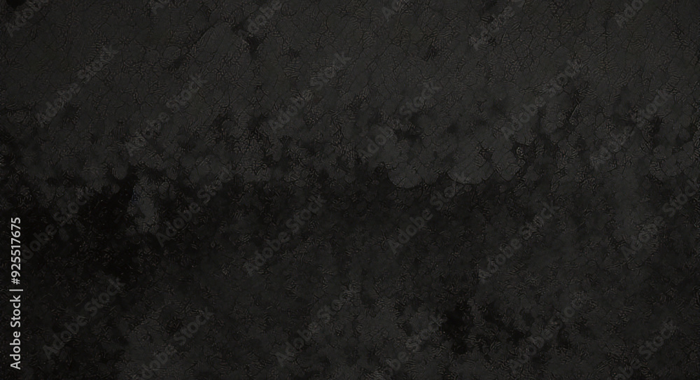 Black background made of real, shiny black paper covered with foil, illuminated by a soft light from above. Black background made of real, shiny black paper covered with foil, illuminated by a soft light from above.