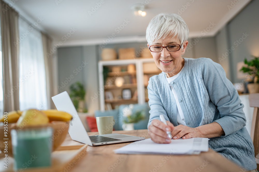 Senior caucasian woman use laptop computer at home for work Senior caucasian woman use laptop computer at home for work